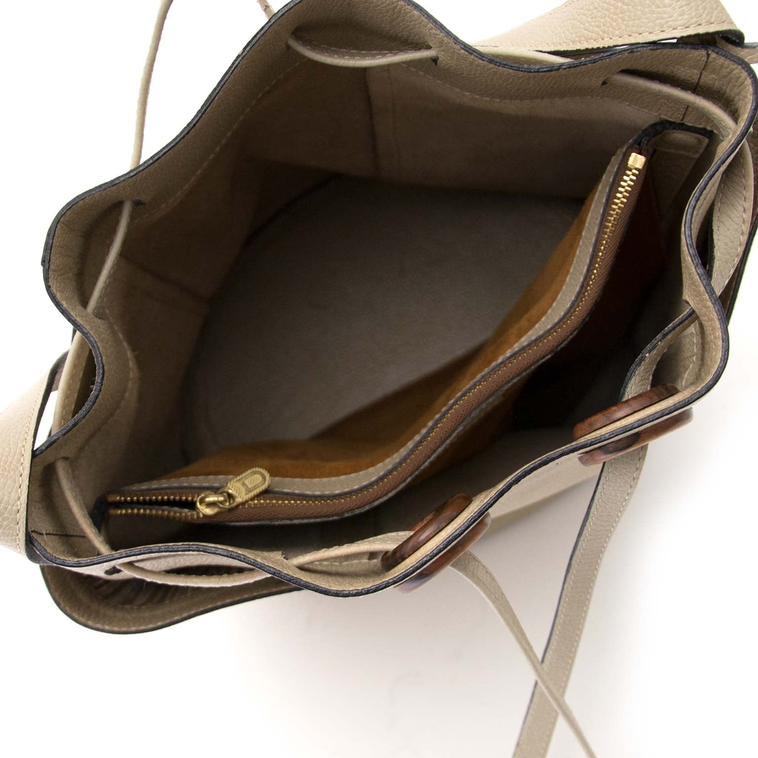 Inside of Delvaux Beige Leather and Toile de Cuir Bucket Bag