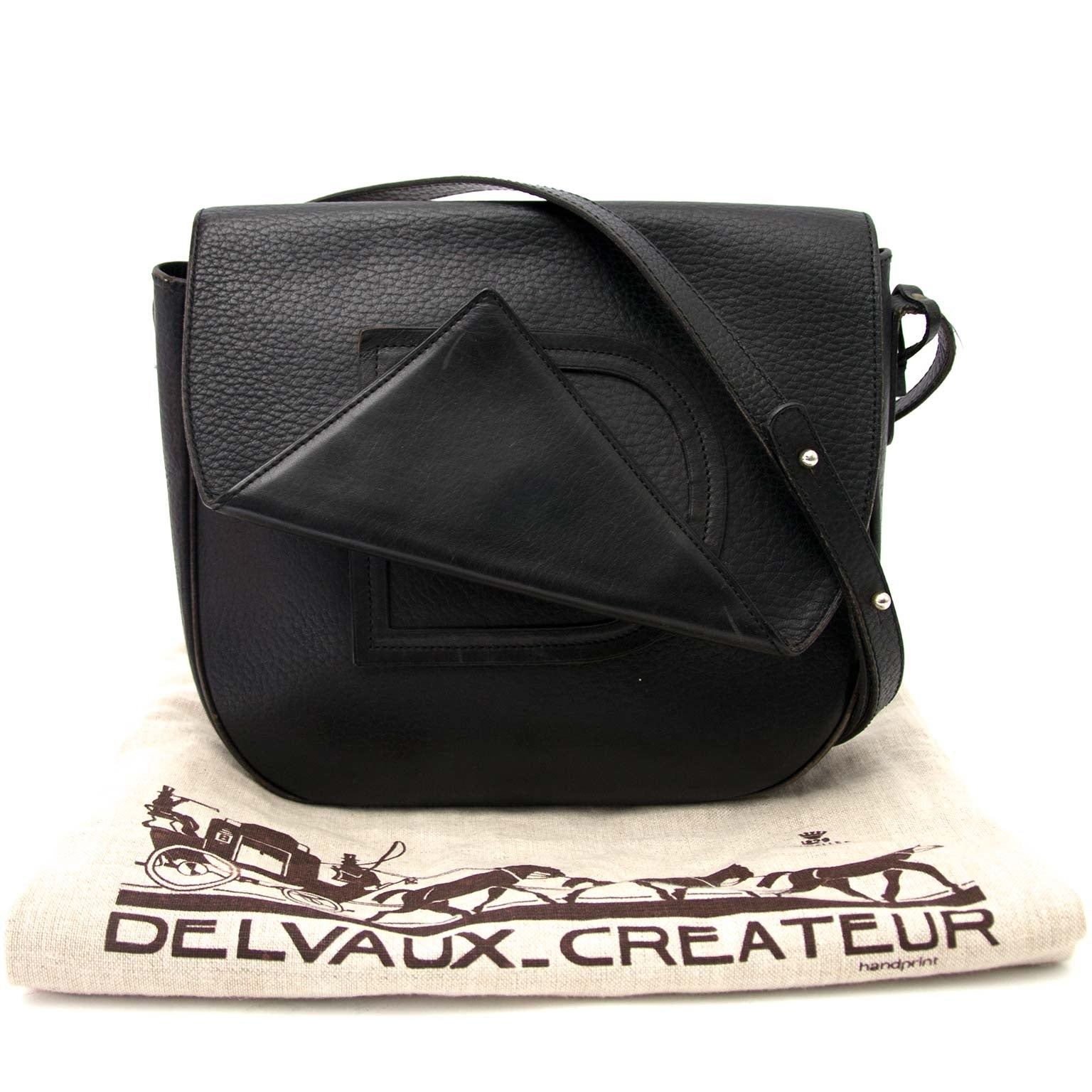 Delvaux Black Textured Leather Saddle Flap Bag Buy authentic designer Delvaux secondhand bags at Labellov at the best price. Safe and secure shopping. Koop tweedehands authentieke Delvaux tassen bij designer webwinkel labellov.