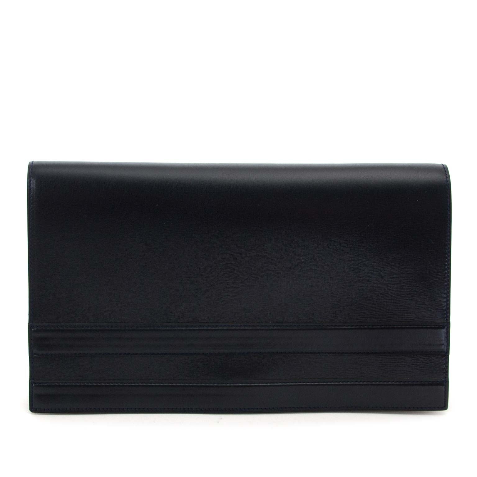 koop Delvaux Dark Blue Leather Clutch en betaal veiling online