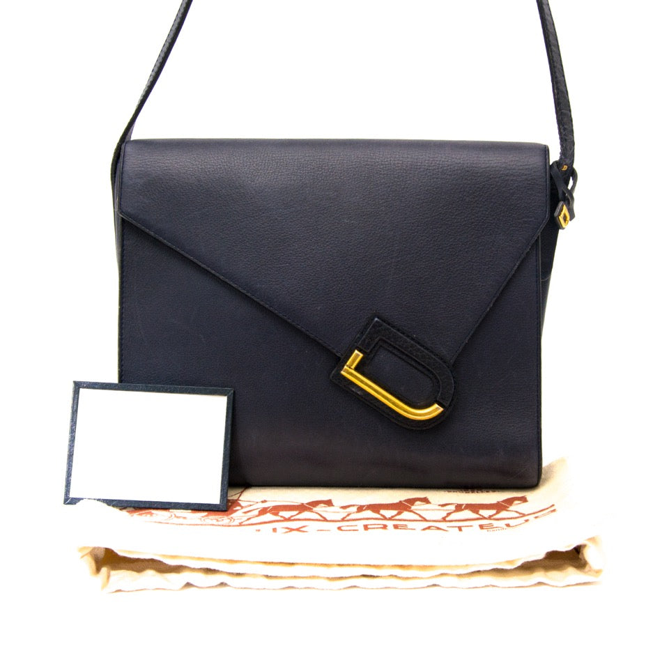 only authentic products such as this Delvaux Dark Blue Enveloppe Bag for the best price on labellov