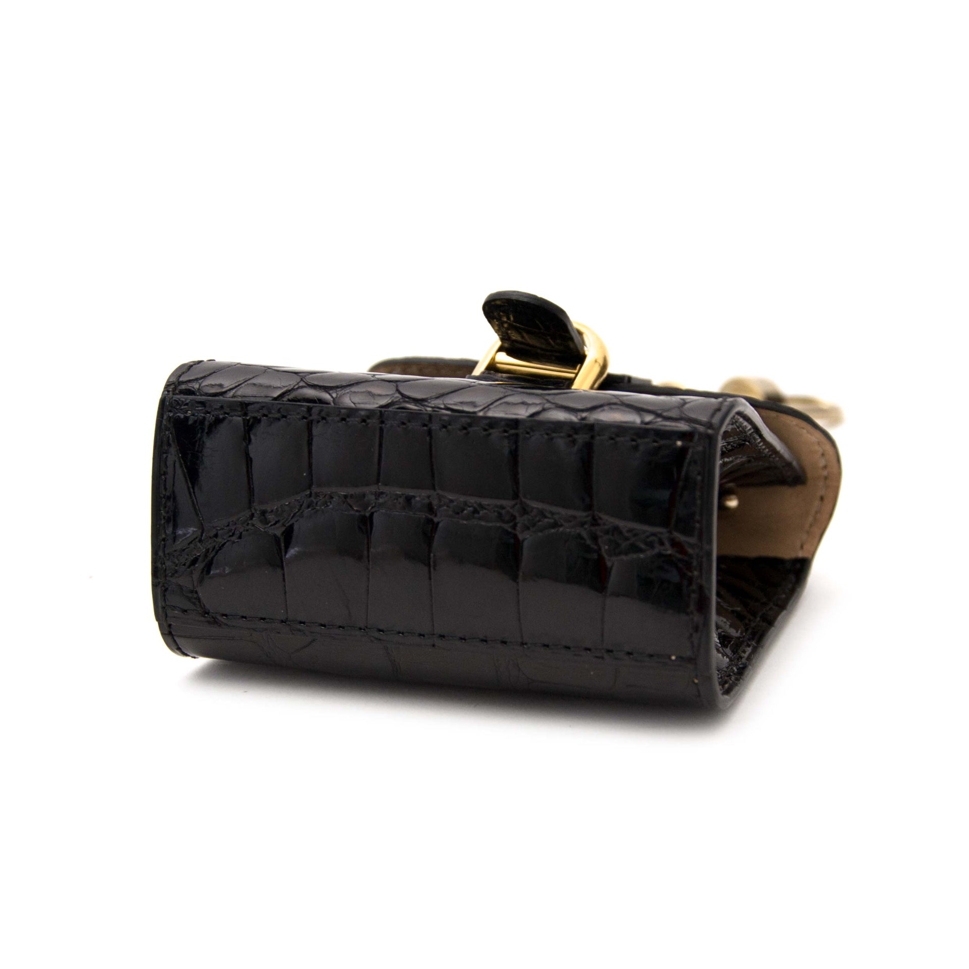 koop veilig online aan de beste prijs jou tweedehands Delvaux Brillant Black Croco Bag Charm