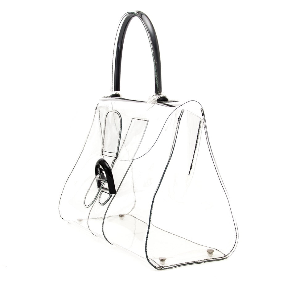 transparant, pvc brillant at labellov for the right price. 100% authentic vintage handbag.