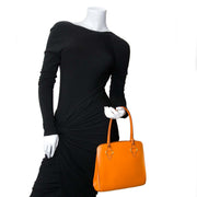 delvaux orange top handle bag now for sale at labellov vintage fashion webshop belgium