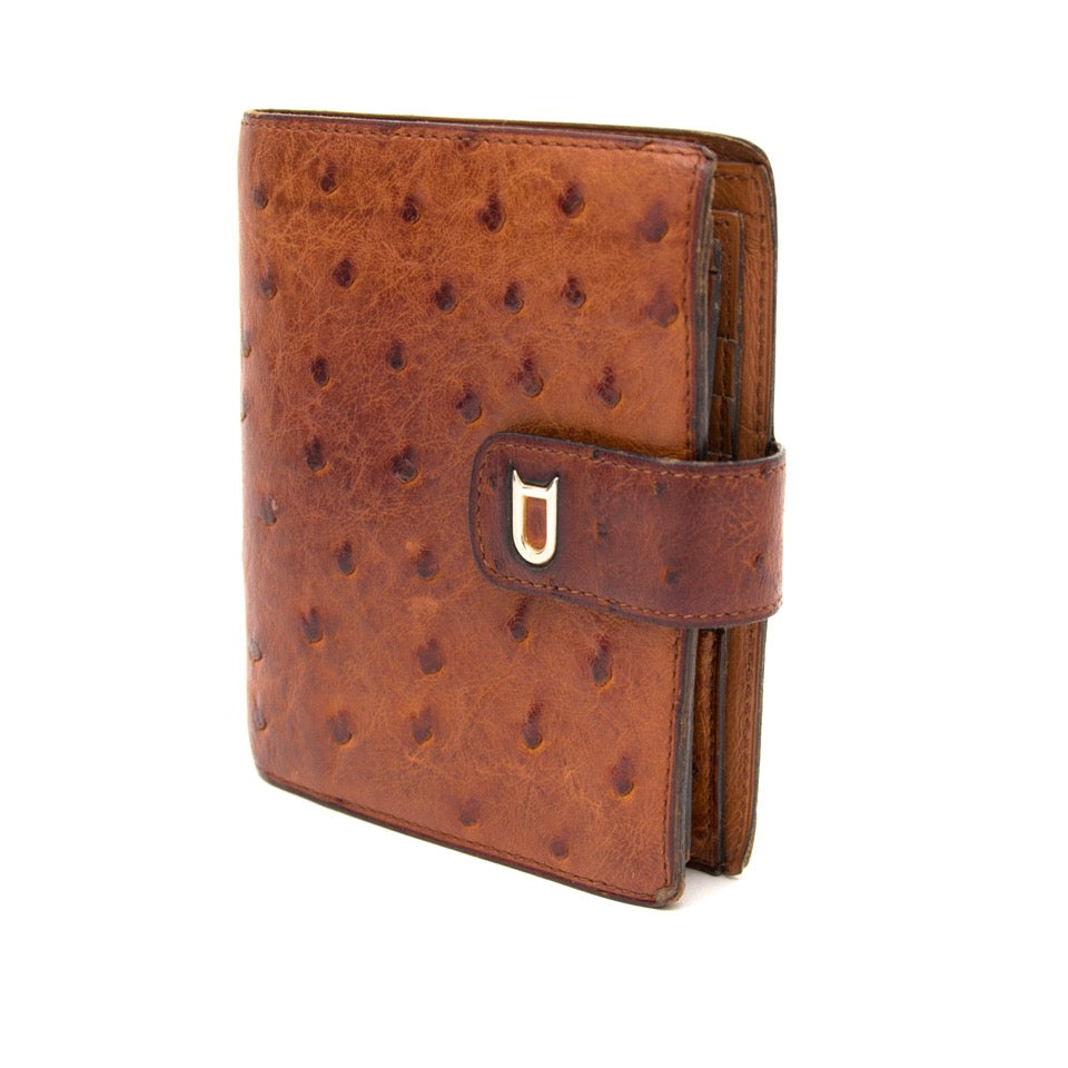 Buy and sell your secondhand designer items such as this Delvaux brown ostrich wallet