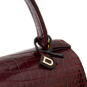 Bent u op zoek naar een Delvaux Tempete PM in Bordeaux croco leder?