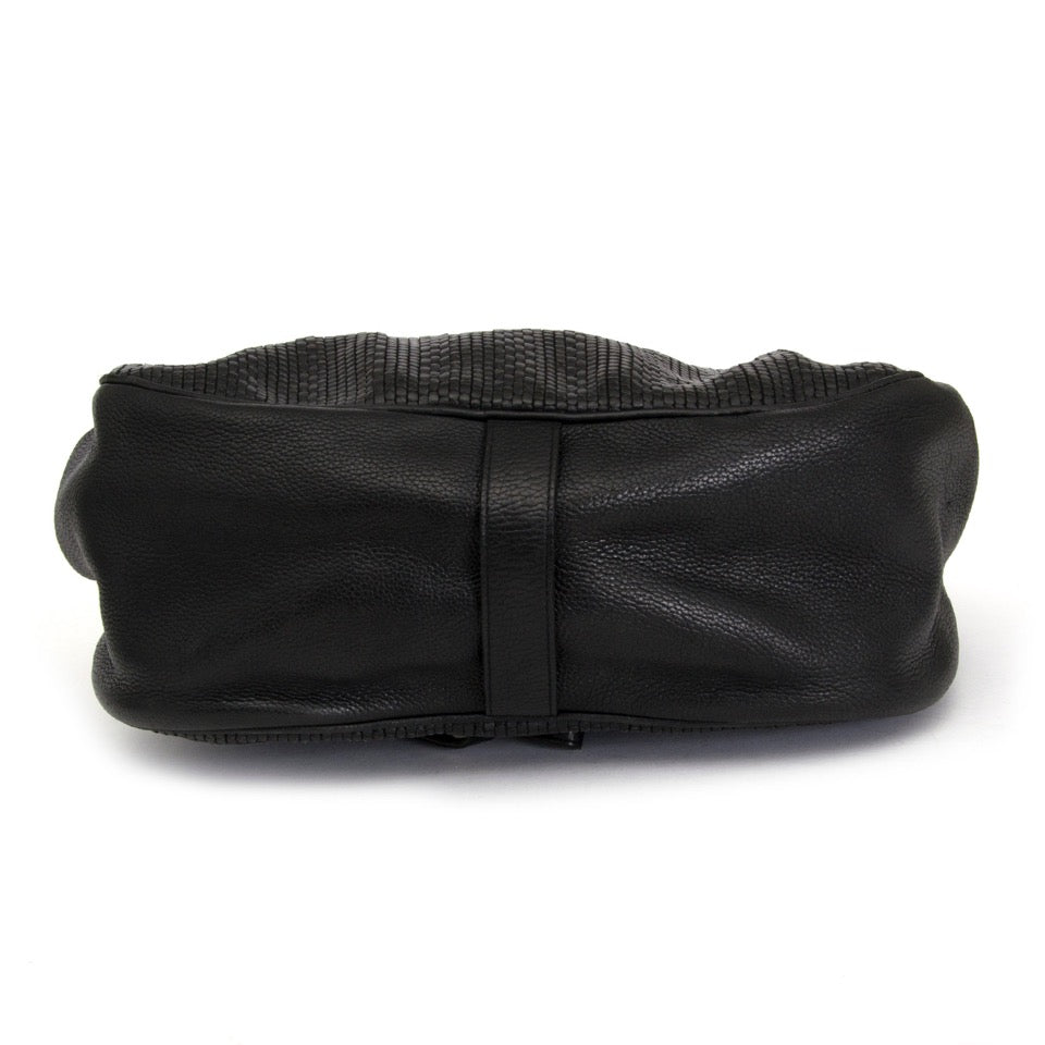 Buy HDelvaux Black cerceau toile de cuir backpack at the right price at LabelLOV vintage webshop. Luxe, vintage, fashion. Safe and secure online shopping. Antwerp, Belgium.
