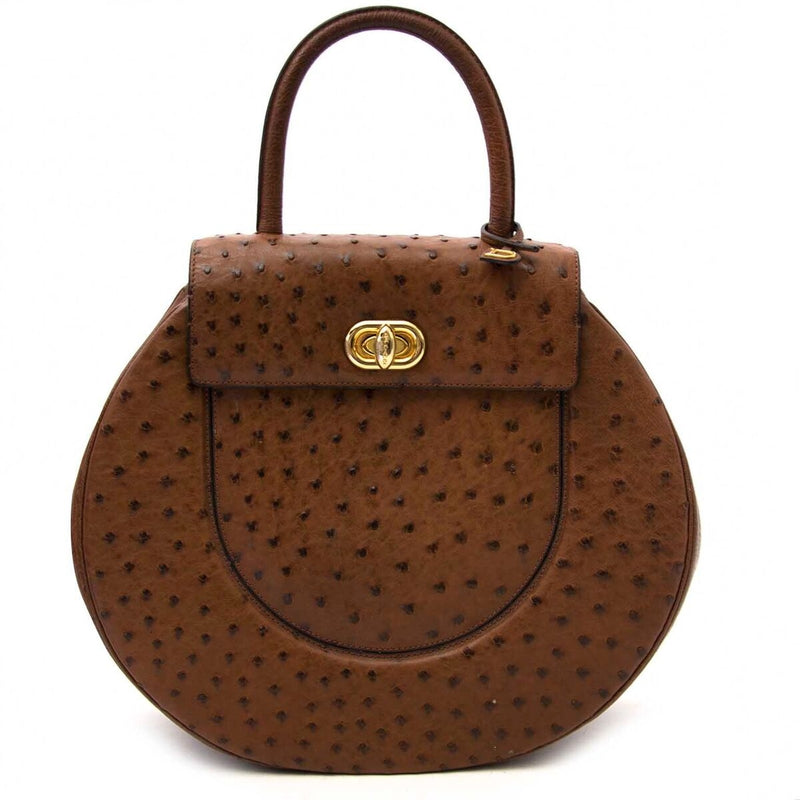 Buy an authentic secondhand Delvaux autruche extase galop bag at the right price at LabelLOV vintage webshop. Safe and secure online shopping.