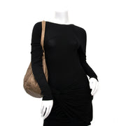 Buy a secondhand Christian Dior Bronze Cannage Drawstring Bag at labellov.com