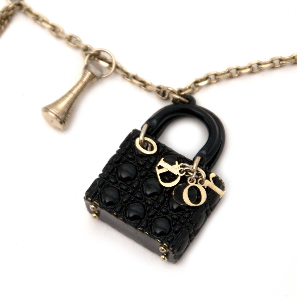 Buy authentic secondhand Dior charm necklace at the right price at LabelLOV vintage webshop. Safe and secure online shopping.