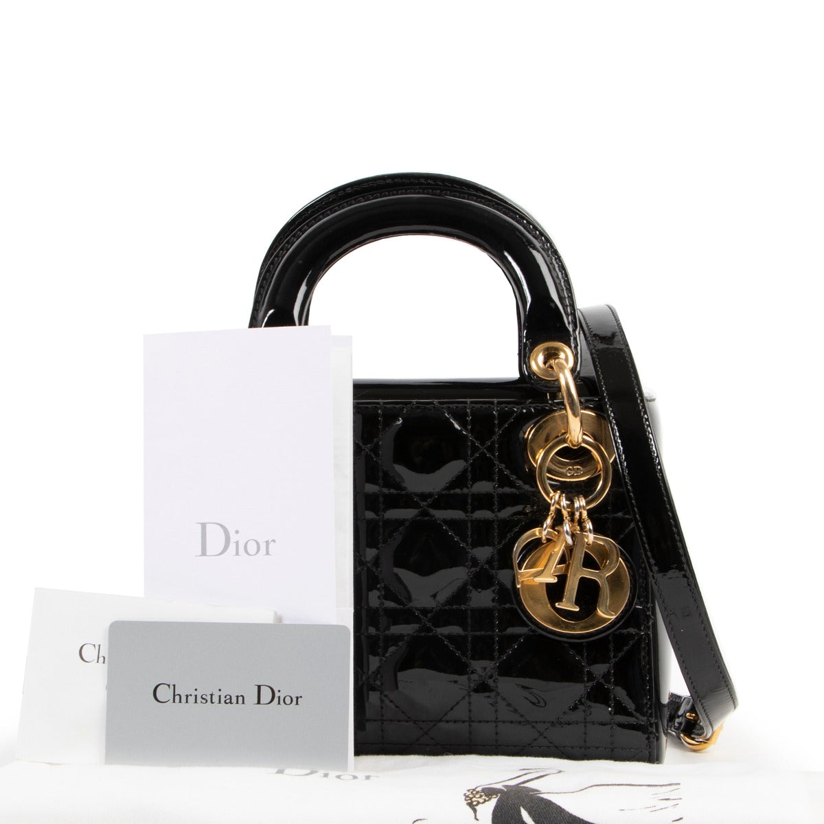 Get this Christian Dior Black Patent Mini Lady Dior at Labellov. Buy and sell your designer items online or in store for a reasonable price and in good condition.