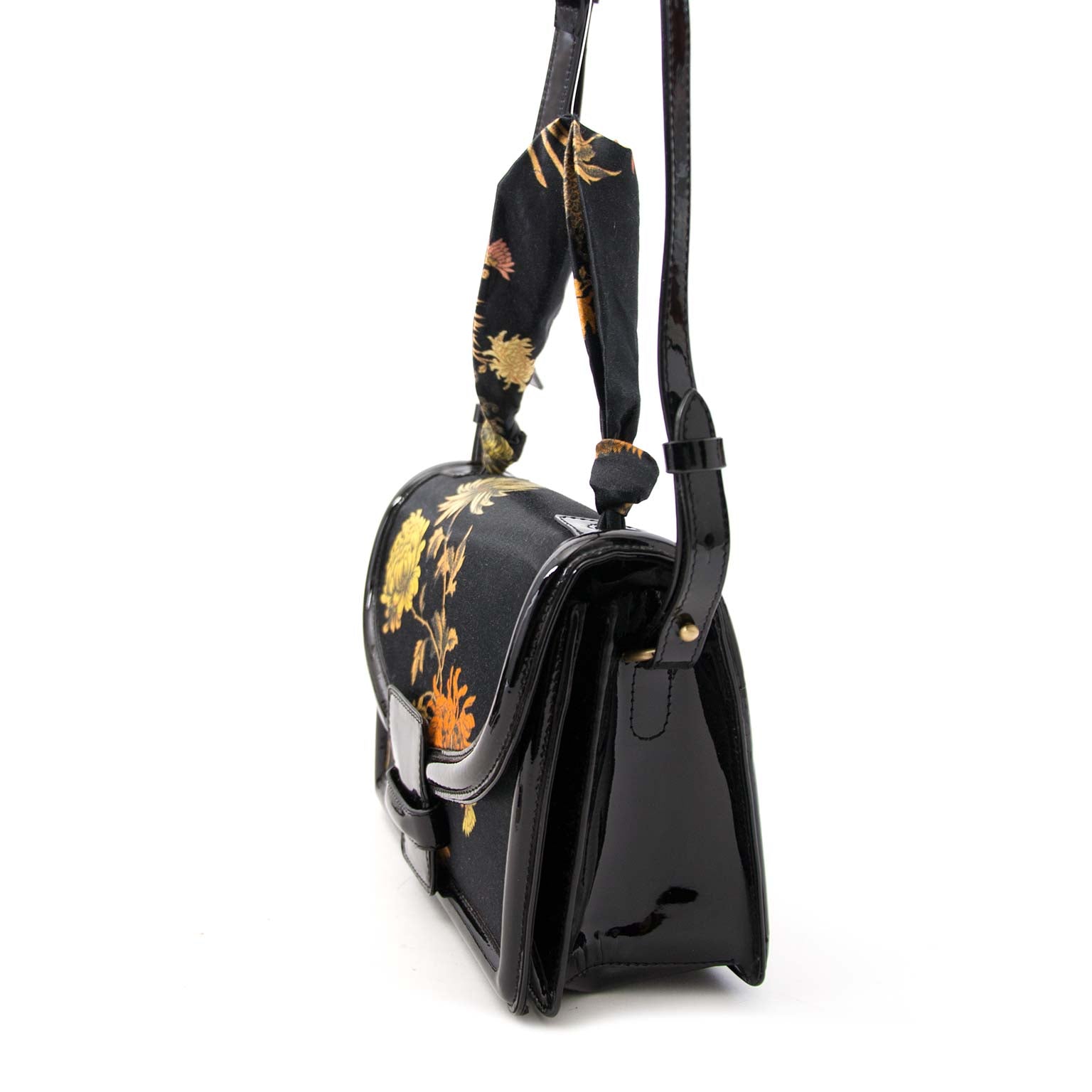 Buy your authentic Dries Van Noten Patent and Oriental Fabric Bag online