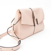 This Delvaux bag is a crafted in Polo calfskin with a matte finish and very small pores. The color 'Nude' is a pastel pink or very light 'rose poudrée'. Dark metallic hardware.