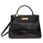 Vintage Hermès Kelly black so black Bag With Shoulder Strap Black Box Calf. Buy online or in the Labellov Boutique Antwerp, Belgium. Labellov is een tweedehands winkel in Antwerpen, België. Seconde main et occasion vintage boutique a Anvers, Belgique.