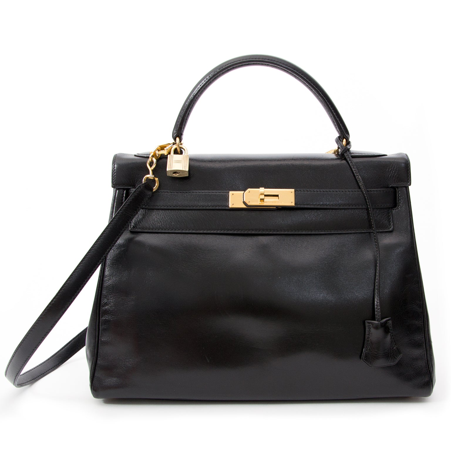 Vintage Hermès Kelly black so black Bag With Shoulder Strap Black Box Calf. Buy online or in the Labellov Boutique Antwerp, Belgium. Labellov is een tweedehands winkel in Antwerpen, België. Seconde main et occasion vintage boutique a Anvers, Belgique.