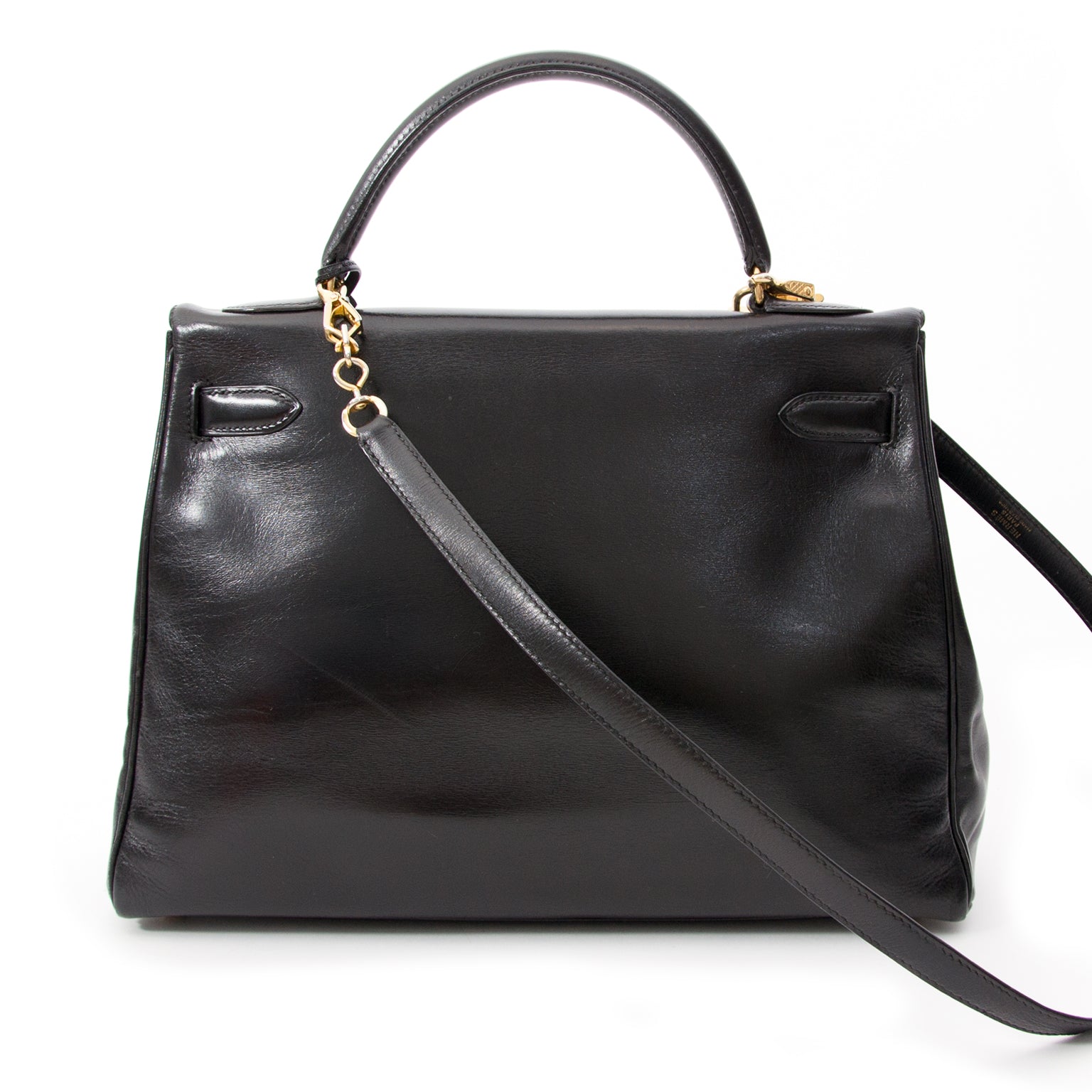 Vintage Hermès Kelly black so black Bag With Shoulder Strap Black Box Calf. Buy online or in the Labellov Boutique Antwerp, Belgium. Labellov is een tweedehands winkel in Antwerpen, België. Seconde main et occasion vintage boutique a Anvers, Belgique.