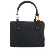 Vintage Gucci Black Fabric Monogram Bamboo Tote. Acheter en ligne pour le meilleur prix sac a main Gucci Beige Fabric Shopper Bag comme neuf.