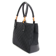 Vintage Gucci Black Fabric Monogram Bamboo Tote. Koop en verkoop van tweedehands gebruikte designer handtassen.