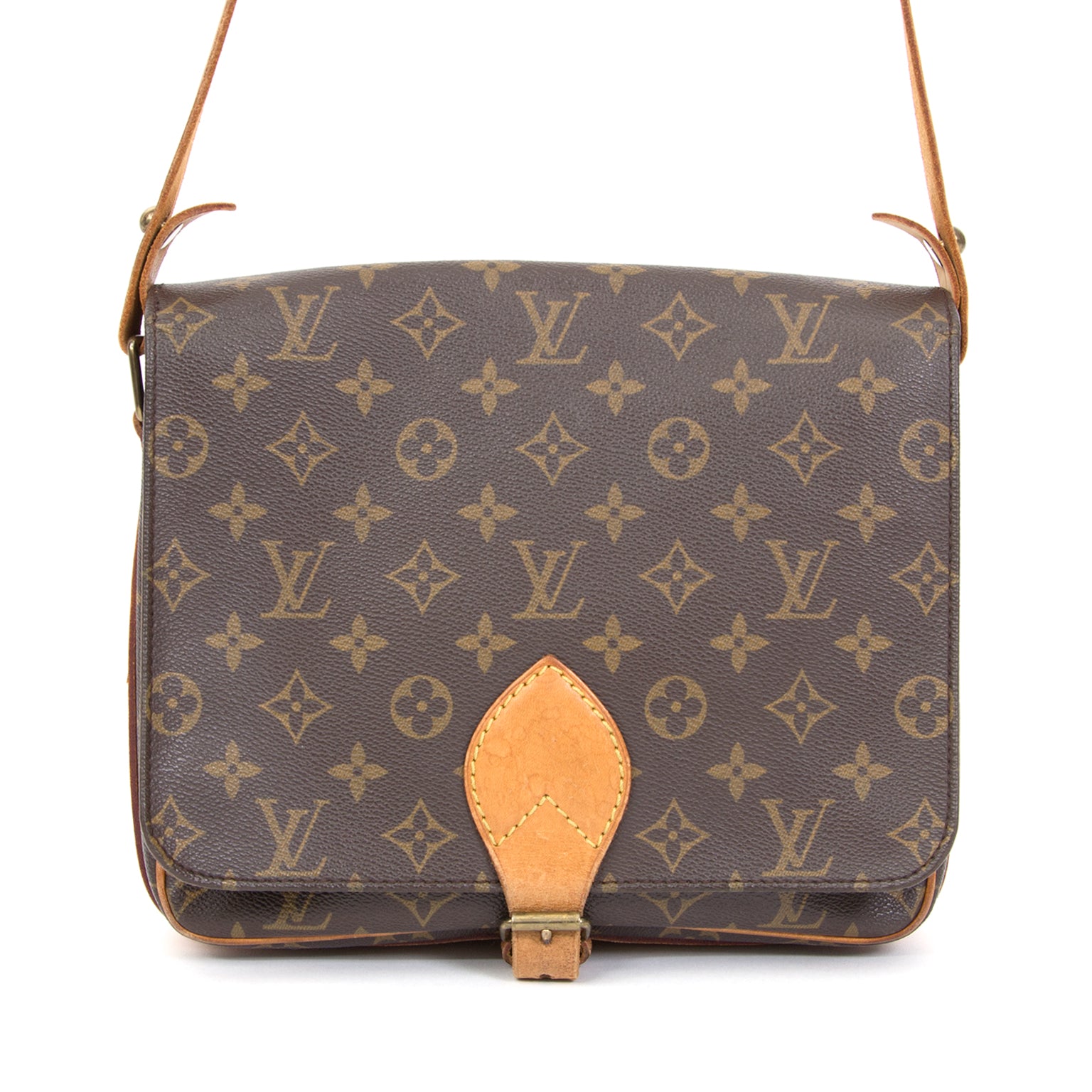 Another perfect Louis Vuitton daybag, the Cartouchière is a shoulder bag in monogram canvas with shoulder strap to carry it comfortably over the shoulder. Top flap is secured with a belt closure.