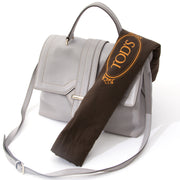 Tod's Pastel Grey Top Handle Bag With Strap This beautiful black wool/silk blend scarf from Gucci featuring a contrasting grey pattern design is finished with a fox fur trim on the top and tassel detail on the bottom. A truly luxurious item to have. Mad