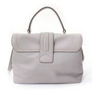 Tod's handbag with top handle and attachable strap. In pastel grey leather.
