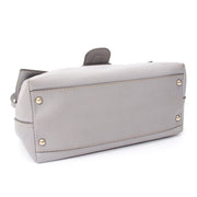 Tod's handbag with top handle and attachable strap. In pastel grey leather.