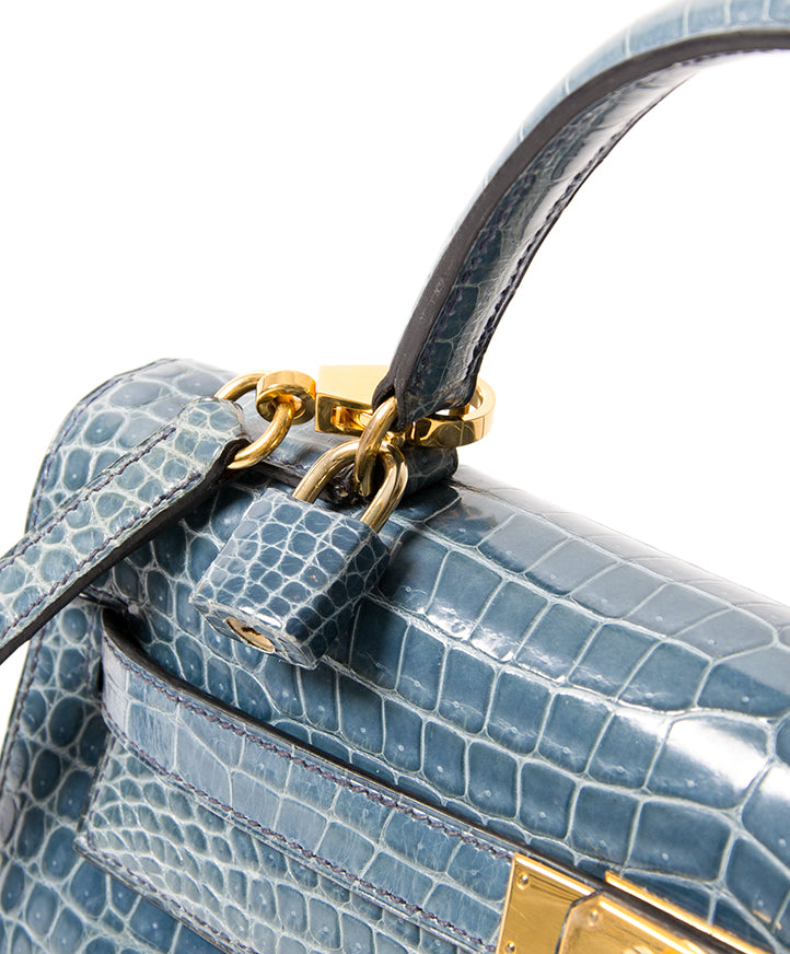 koop snel en veilig tweedehands Hermes kelly 32 blue jean in croco leer net als nieuw tweedehands