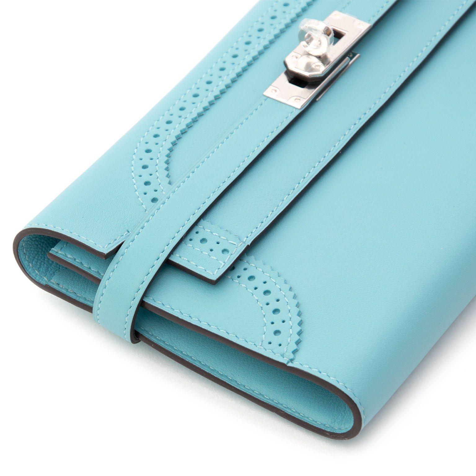 NEW Hermes Kelly Classic Ghillies Wallet Veau Swift Blue Atoll PHW on www.labellov.com. Shop safe and secure online. Preowned handbags. Worldwide shipping.