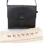 Our Belgian Designers designed this classic model by Delvaux. This cross body black bag has a magnectic button closure and adjustable shoulder straps. The interior is simpel and in camel suede. Beauty in his simplicity, Audrey Hepburn would know what do.