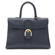 Delvaux Brillant 'Mustang' bag is a top handle bag in midnight blue Jumping calsfkin. Gold-tone hardware throughout.