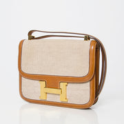 Sac à main Hermès Constance toile beige et cuir cognac brun, or, seconde main occasion authentique prix correct webshop vintage labellov designer marques de luxe en ligne shopping Anvers mode Belgique