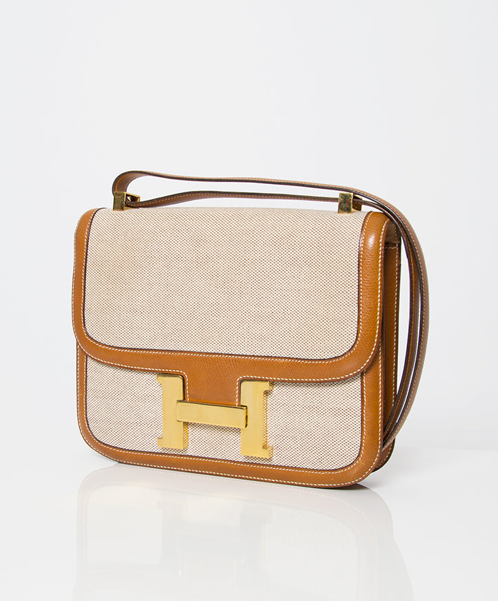 Sac à main Hermès Constance toile beige et cuir cognac brun, or, seconde main occasion authentique prix correct webshop vintage labellov designer marques de luxe en ligne shopping Anvers mode Belgique