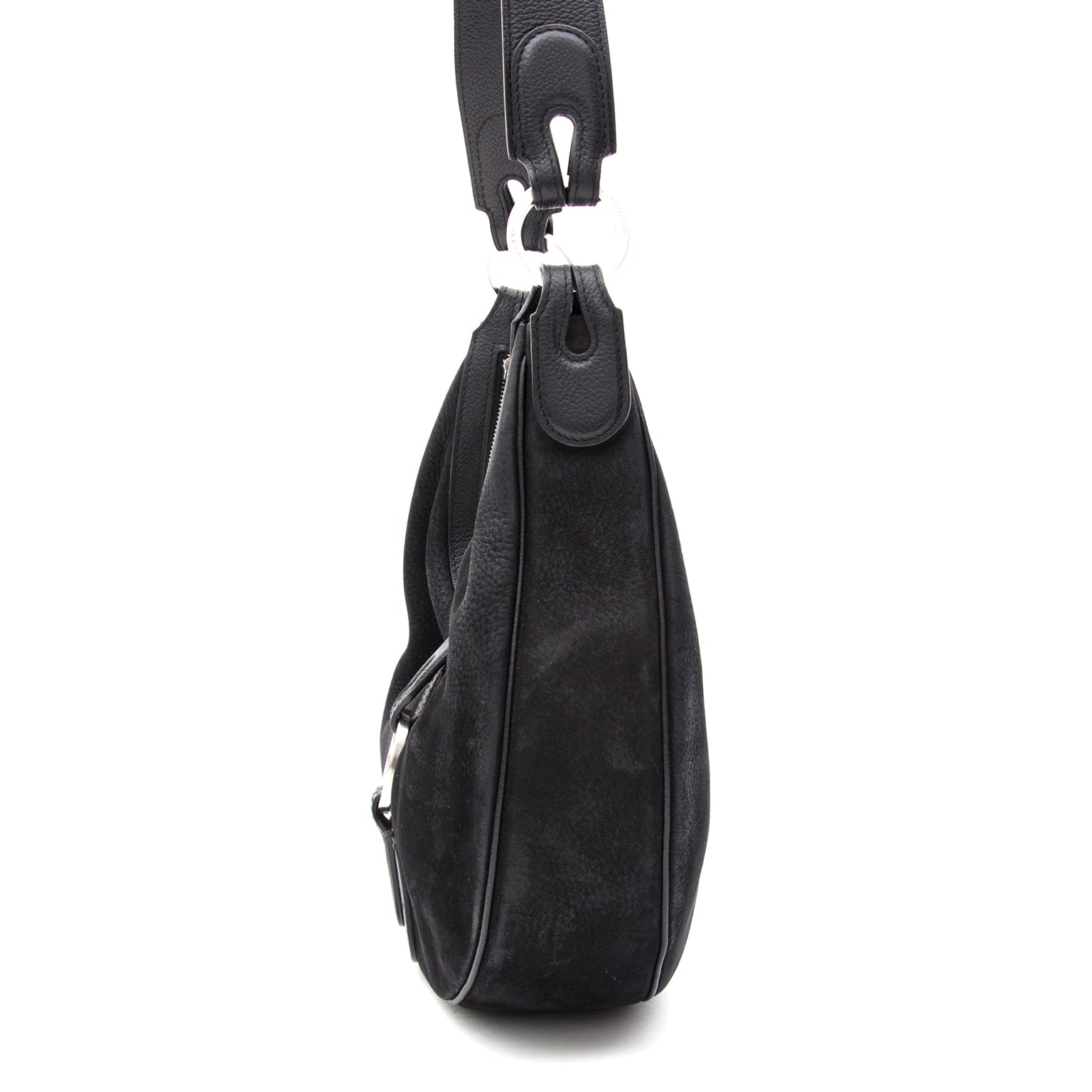 This is a Delvaux hobo shoulder bag in black nubuck with brushed steel hadrware. Zipper closure. Comes with receipt of purchase and leather treatment information.