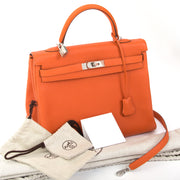 shop online Hermes Orange Kelly 35 Retourne Veau Togo in perfect condition at the best price