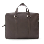 From the Delvaux mens collection, 'Newspaper Bag' in sellier vegetal calfskin. Coffee brown color, black-brown.