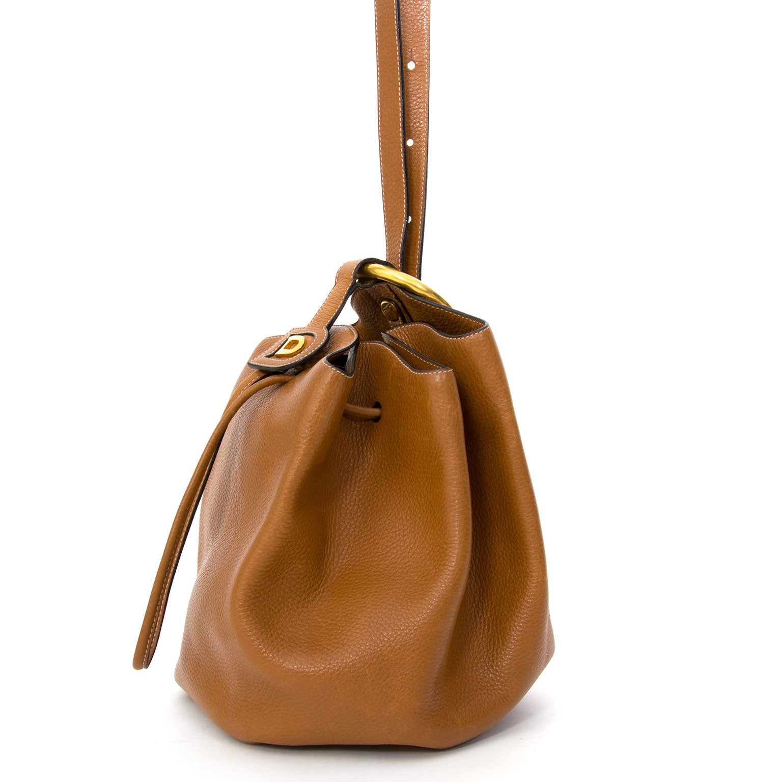 Vintage Delvaux Vent des Roses Cognac Bucket Bag. Buy authentic secondhand Delvaux bags at the right price at LabelLOV vintage webshop