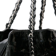 This Chanel tote has a high-gloss patent leather exterior and metallic interior lining. Double 'CC' stitched logo on the front.