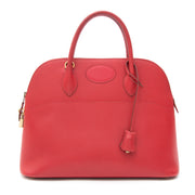 Pre-owned Hermès Bolide Top Handle Bag Red GHW. Acheter secure seconde main 100% authentic sac a main Hermes Bolide en cuir d'or. Koop veilig online tweedehands luxe handtas Hermes Bolide.