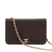 Chanel Brown Quilted Fabric Flap Bag i Chanel flap bag made from quilted silk with long gold-tone wool entwined shoulder strap.
