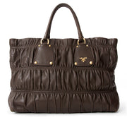 Prada Brown Gaufre Bag with Prada's signature acquard lining. Visit Labellov for a wide variety of preloved vintage luxury bags.