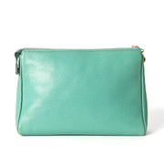 Seafoam green puch by Chanel with CC embossed pebbled leather upper for the best price at Labellov Antwerp online store