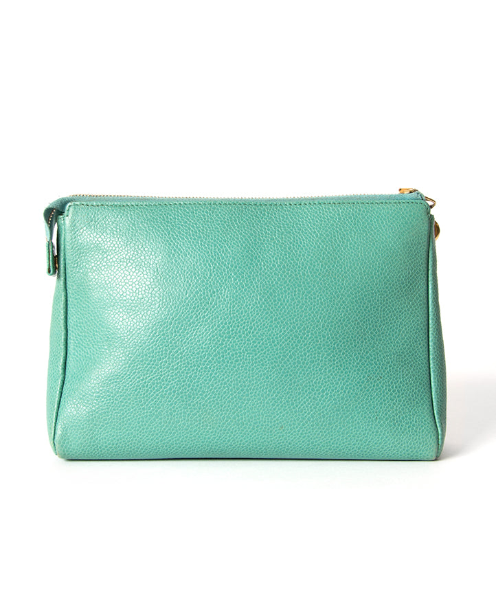 Seafoam green puch by Chanel with CC embossed pebbled leather upper for the best price at Labellov Antwerp online store