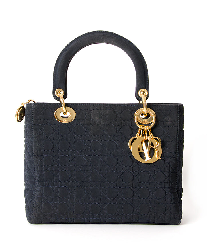 Lady Dior handbag in Navy Fabric Small Size with golden hardware. Buy at the right price on Labellov.com