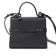 Brand new, storebought Delvaux Tempête Micro top handle bag with shoulder strap. Handmade in black 'Calf Souple' leather with dark silver-tone hardware. This clutch sized edition of Delvaux' timeless classic Tempête bag simply looks exquisite when worn