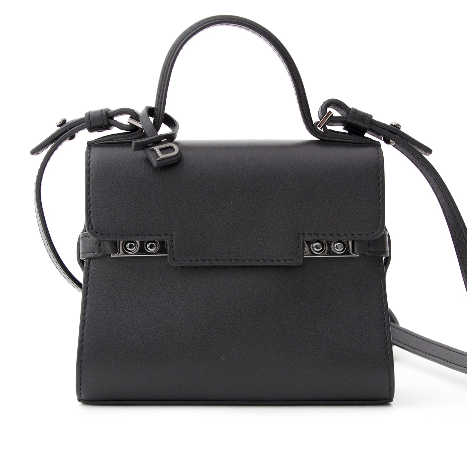 Brand new, storebought Delvaux Tempête Micro top handle bag with shoulder strap. Handmade in black 'Calf Souple' leather with dark silver-tone hardware. This clutch sized edition of Delvaux' timeless classic Tempête bag simply looks exquisite when worn