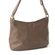 A lovely Delvaux hobo bag with signature 'D' logo stitched application. The gold-tone hardware matches the smooth taupe calfskin beautifully. The leather feels smooth to the touch and has a slight shine. Gorgeous simplicity for everyday wear and to any o