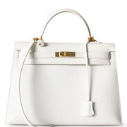 Hermès Kelly Bag GHW Shoulder Strap. Buy authentic secondhand Hermès bags at the right price at LabelLOV vintage webshop. Safe and secure online shopping. Koop authentieke tweedehands Hermès tassen met juiste prijs bij LabelLOV.