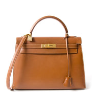 koop veilig online tweedehands designer Hermes Kelly 32 goud aan de beste prijs, 100% authentiek
