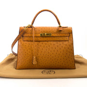 Hermès Kelly 32 Ostrich Gold GHW kopen en verkopen aan de beste prijs bij Labellov