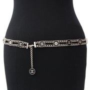 Pretty Chanel chain belt with black enameled coins featuring the signature Camelia flower and double 'C' logo.