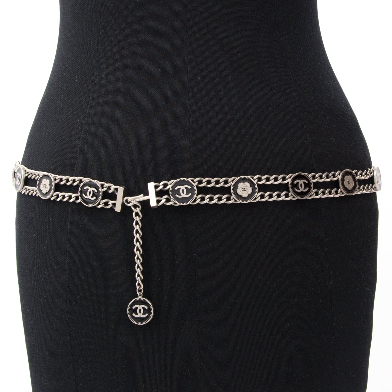 Pretty Chanel chain belt with black enameled coins featuring the signature Camelia flower and double 'C' logo.